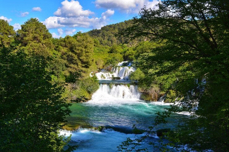 scenic view waterfall forest against sky 1048944 2717355