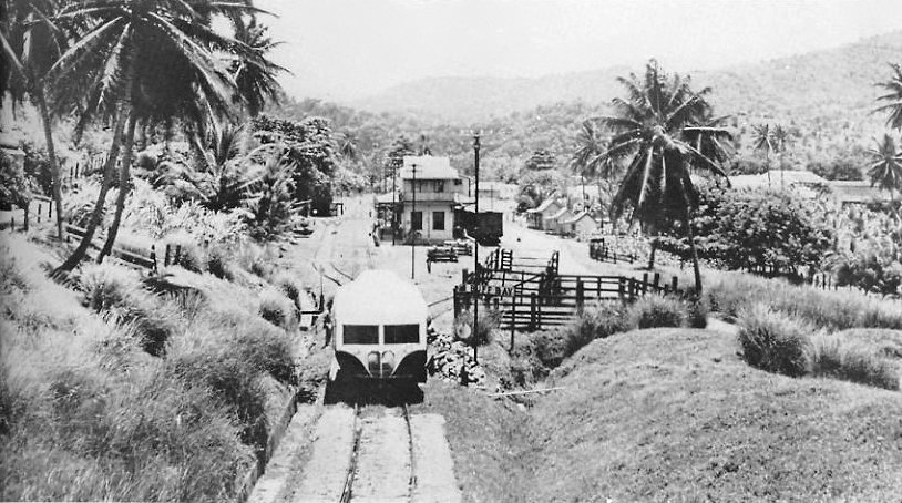 Jamaican railroad with railcar and station 1960